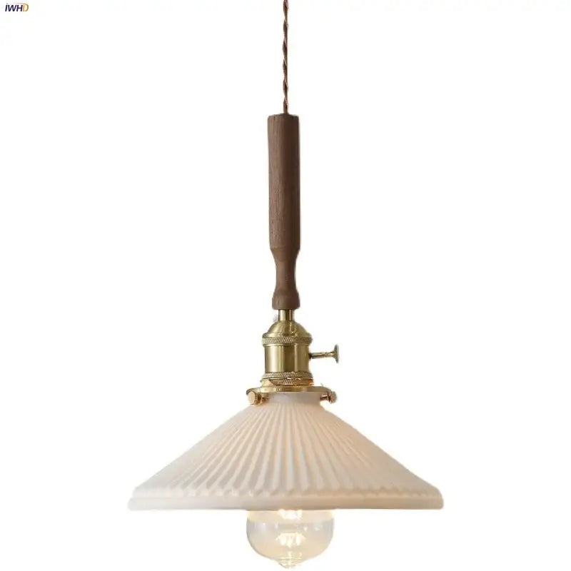 Vintage brass and ceramic walnut wood pendant light with warm brass fixture dark wood handle and off-white ribbed shade