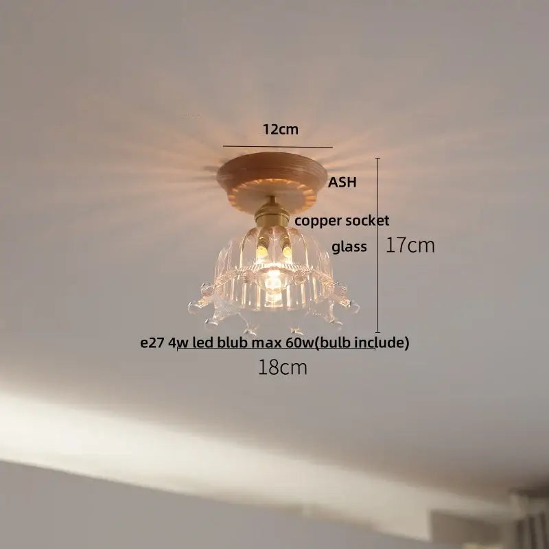 Vintage brass and clear glass led ceiling light featuring a delicate glass chandelier with copper socket and ash base