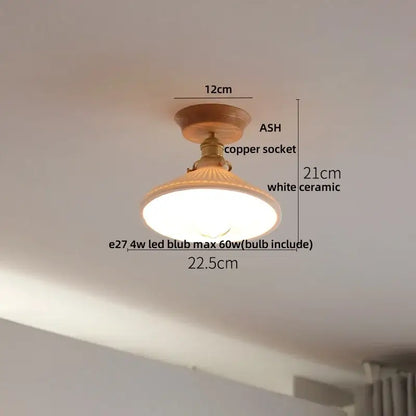 A warm-toned vintage ceiling light with wooden base copper socket and white ceramic shade for decorbites clear glass led lighting