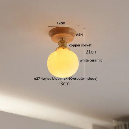 A vintage brass and clear glass led ceiling light with a warm white ceramic globe and ash wood mount for bedroom decorbites ceiling light