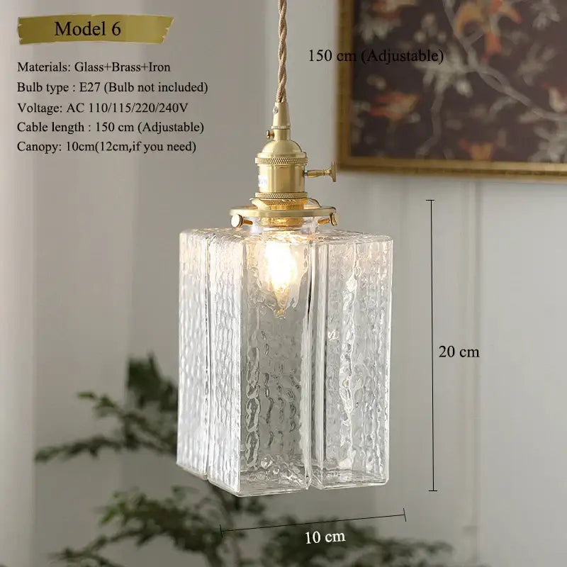 Model 6 pendant light features clear textured glass with brass and iron hardware in a vintage floral kitchen shade