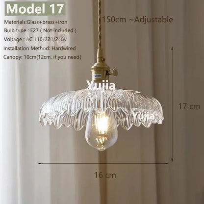 Vintage brass and clear glass pendant light with polished copper fixture and adjustable chain for kitchen use