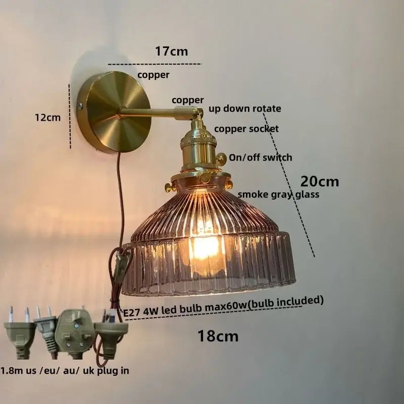 Vintage brass wall lamp with pull chain switch featuring a copper sconce and ribbed smoke gray glass shade
