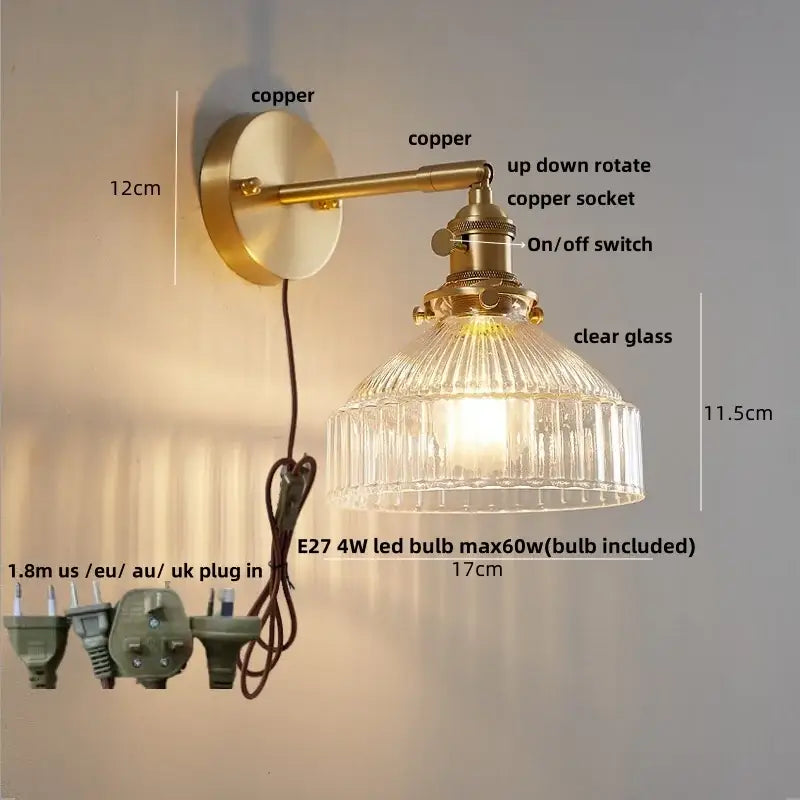 Vintage brass wall lamp with clear glass shade and pull chain switch designed for bedroom lighting