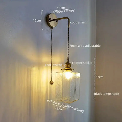 Vintage brass and glass led wall lamp with antique brass-finished copper and textured clear glass shade