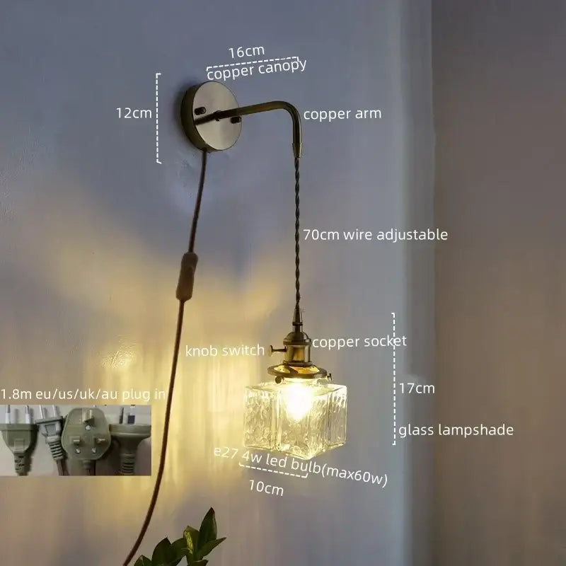Vintage brass and glass led wall lamp featuring an antique copper sconce with faceted clear glass and adjustable wire