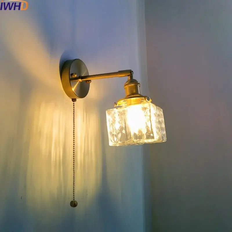 Vintage brass and glass led wall lamp with faceted shade and ornate pull chain for bedroom lighting
