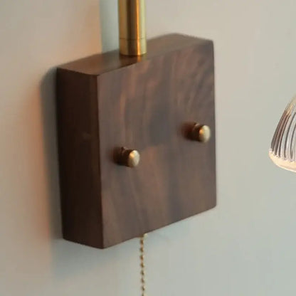 Dark wood wall lamp base with brass accents and two round knobs for vintage glass pink led bedroom sconce