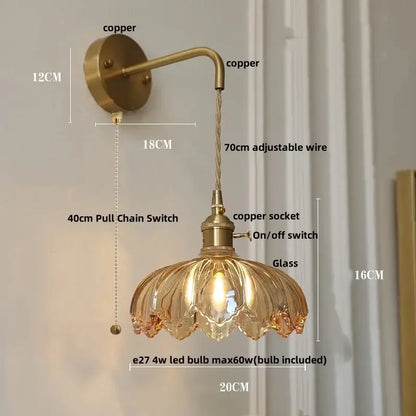 Vintage brass wall lamp featuring an antique brass finish, green glass led shade, and adjustable copper wire arm