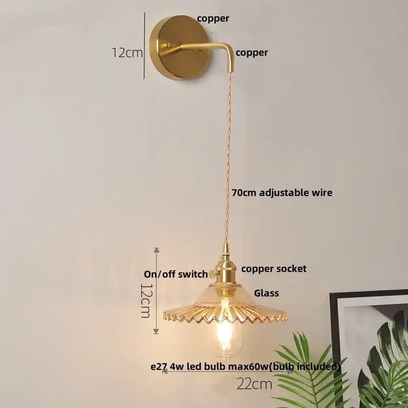 Vintage brass wall lamp with gold-toned copper body, fluted green glass led shade, and adjustable 70cm wire