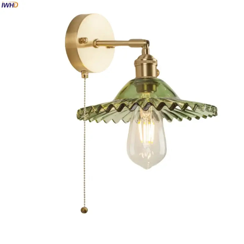 Vintage brass wall light featuring green glass led scalloped shade and filament bulb for bedroom sconce lighting