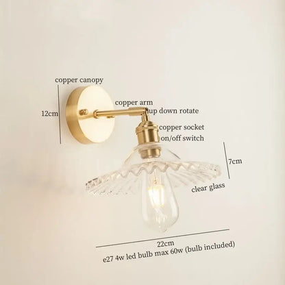 Vintage brass wall light with a green glass led ornate petal-shaped shade for bedroom decor