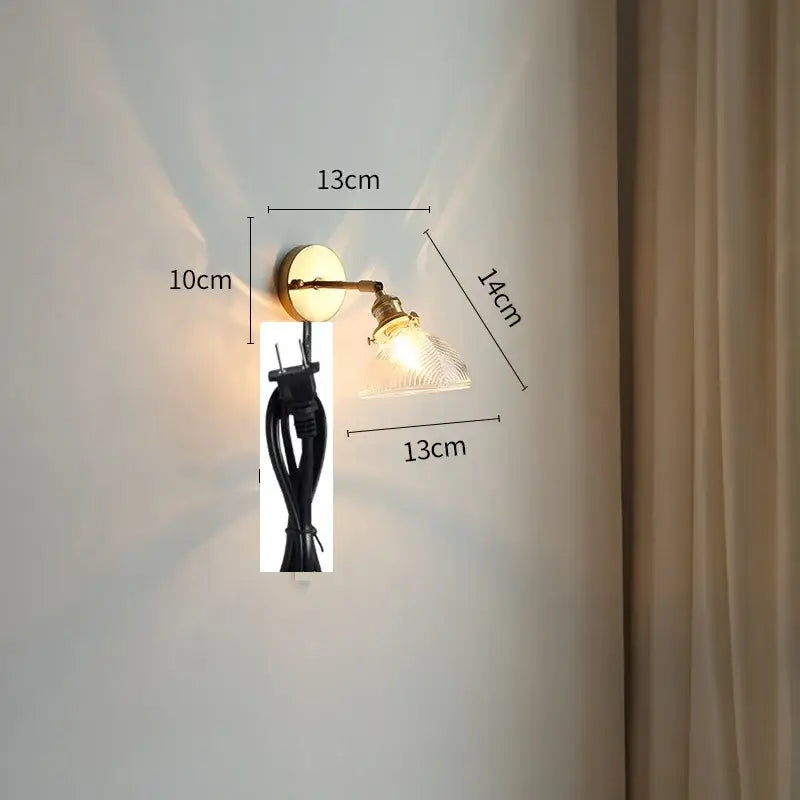 Vintage brass and green glass led wall lights with adjustable arm and clear textured glass shade for bedroom use