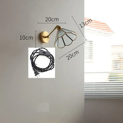 Vintage brass wall lights with green glass led shade featuring black metal framing and petal-like segments for bedroom
