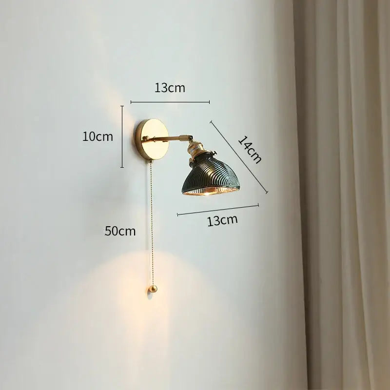 Vintage brass led wall lights with dark green ribbed glass shade and adjustable arm for bedroom wall lighting