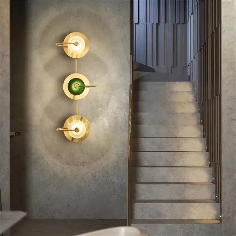 Three vintage brass wall lamps with green glass shades as metal wall art light for living room decor