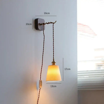 A warm-toned ribbed glass led wall sconce with vintage brass and dark metal fixture decorbites led wall light