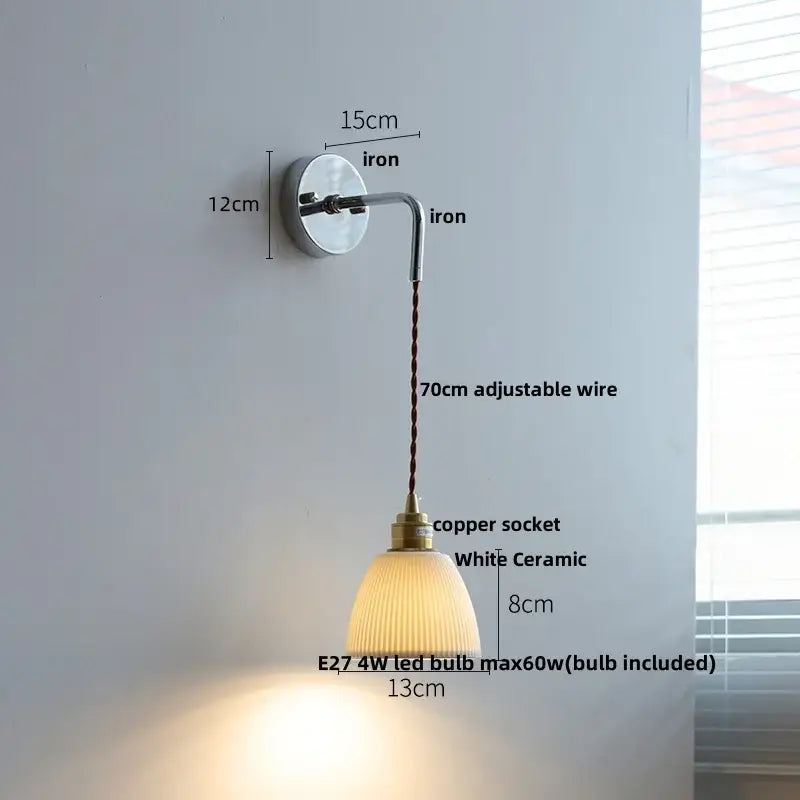 A sleek wall sconce with polished iron bracket, adjustable copper socket, and white ceramic shade for ceramic led wall decorbites
