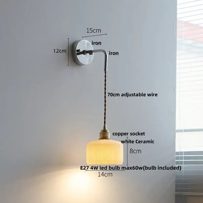 A warm white ceramic led wall sconce with ribbed texture and vintage brass copper socket for decorbites ceramic led decor