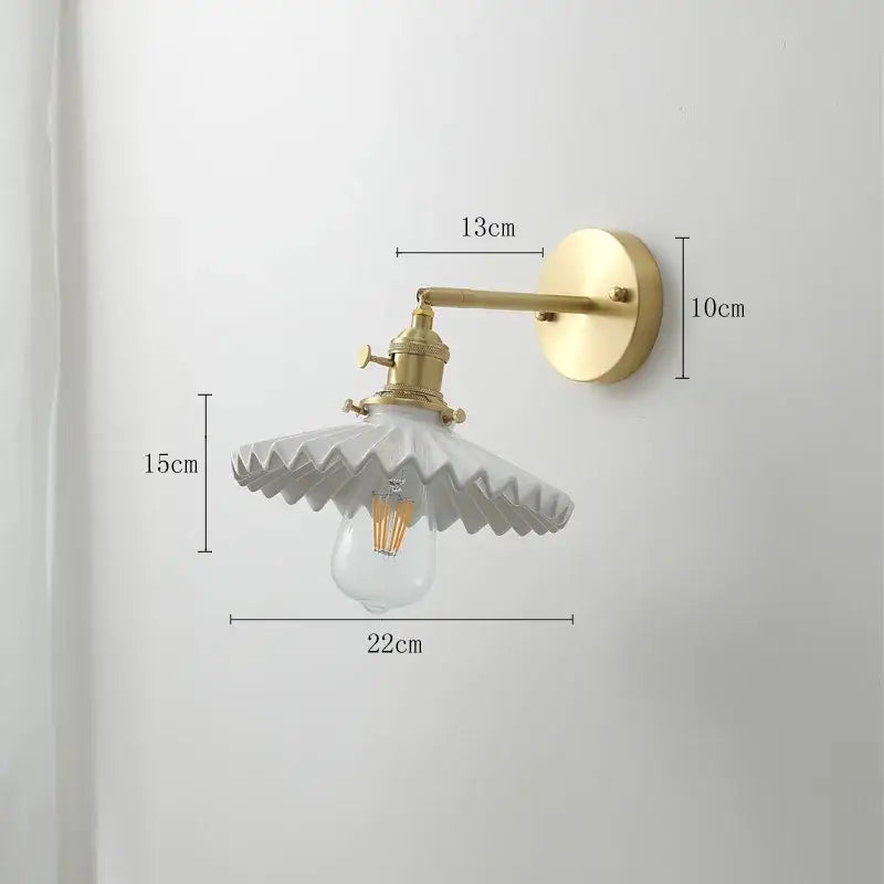 Vintage brass led wall lamp with gold metal arm and scalloped white ceramic shade for bedroom lighting