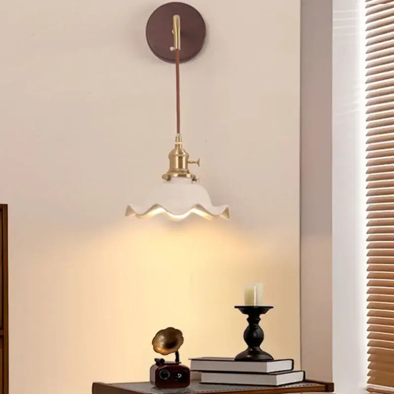 Vintage brass wall sconce with scalloped off-white glass shade and dark brown backplate for decorbites ceramic wood led interiors