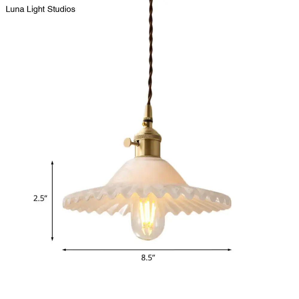 DecorBites™ Chloe scalloped pendant light with frosted white glass shade and industrial brass hardware suspended by twisted cord