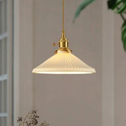 Vintage brass pendant light with off-white ribbed glass white shade and polished copper fixture for dining room use
