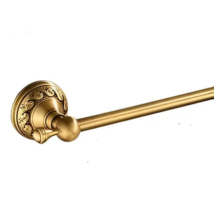 Gold-colored brass bathroom accessories set towel rack with ornate circular base and smooth cylindrical bar decorbites brass bathroom