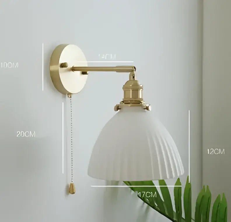 Vintage brass ceramic wall lamp with ribbed white glass shade mounted on brass-finished metal arm for bedroom decorbites ceramic wall lighting