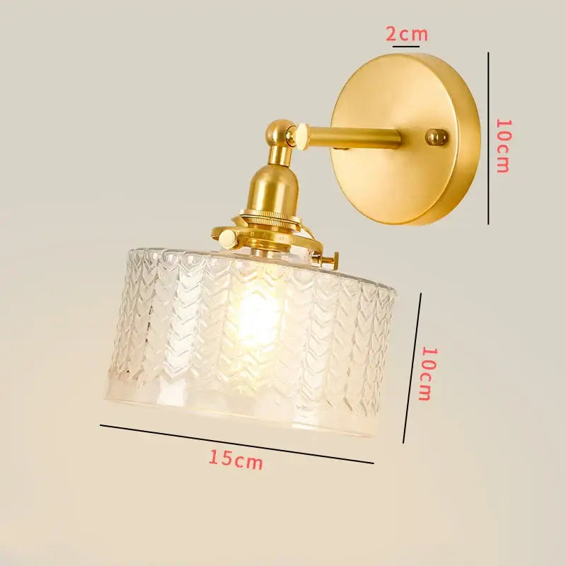 Vintage brass chevron clear glass led wall lamp featuring a metal arm and intricate glass shade for bedroom sconce use