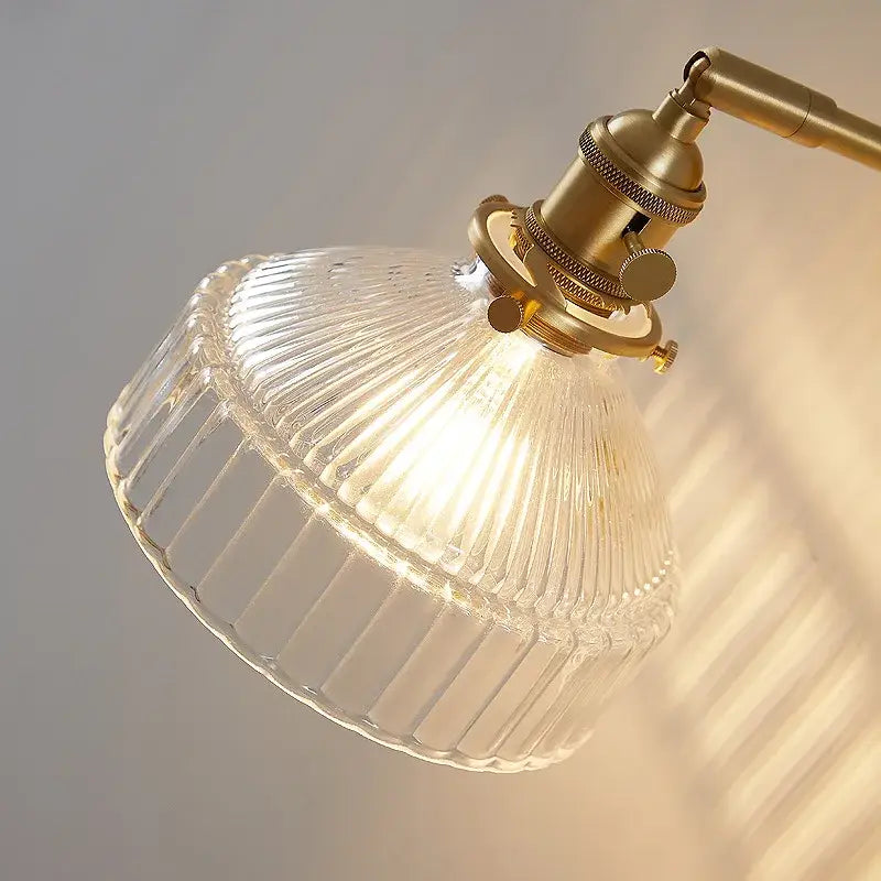 Vintage brass clear glass wall light with ribbed clear glass lampshade and brass-finished metal arm decorbites clear glass