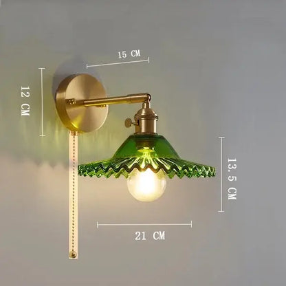 Vintage brass wall light with emerald green scalloped clear glass shade and ribbed metal arm for bedroom decorbites clear glass