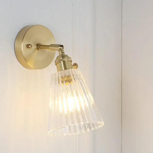 Vintage brass clear ribbed glass wall sconce with led incandescent compatible light for bedroom use