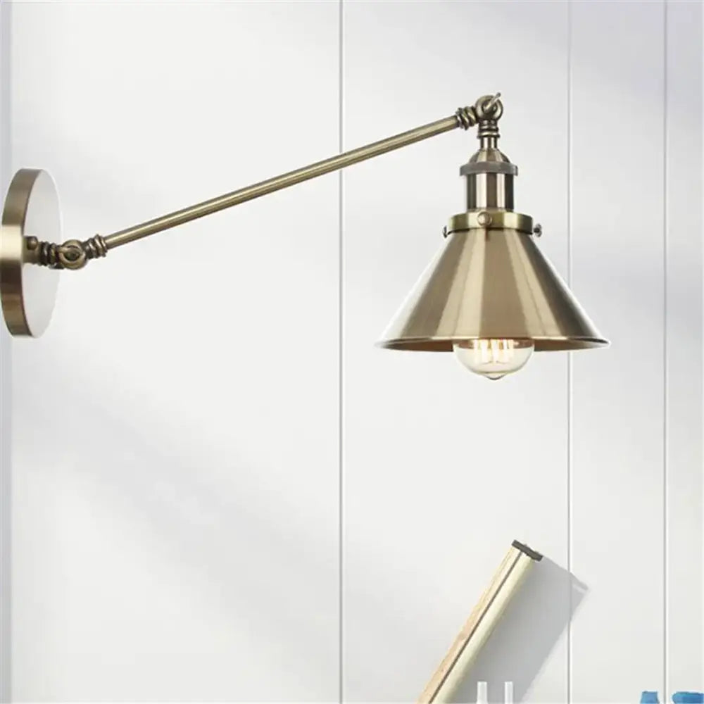 Vintage brass copper wall light featuring a brass-finished industrial-style sconce with conical shade and exposed bulb