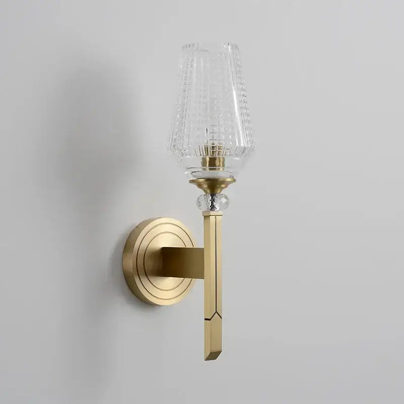 Vintage brass crystal copper wall lamp with gold-toned wall sconce and clear textured glass shade for warm bedroom light