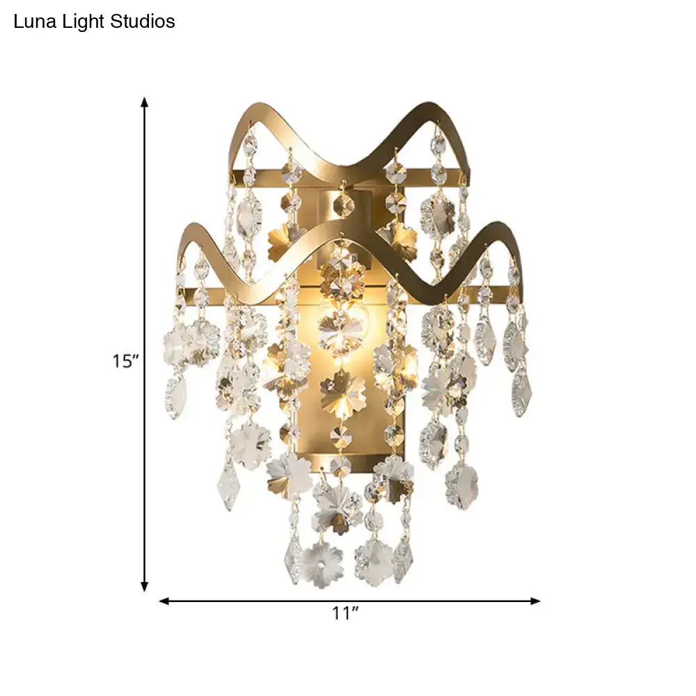 Vintage brass crystal wall sconce with gold-toned metal and clear crystal flowers direct wired for bulb base power source