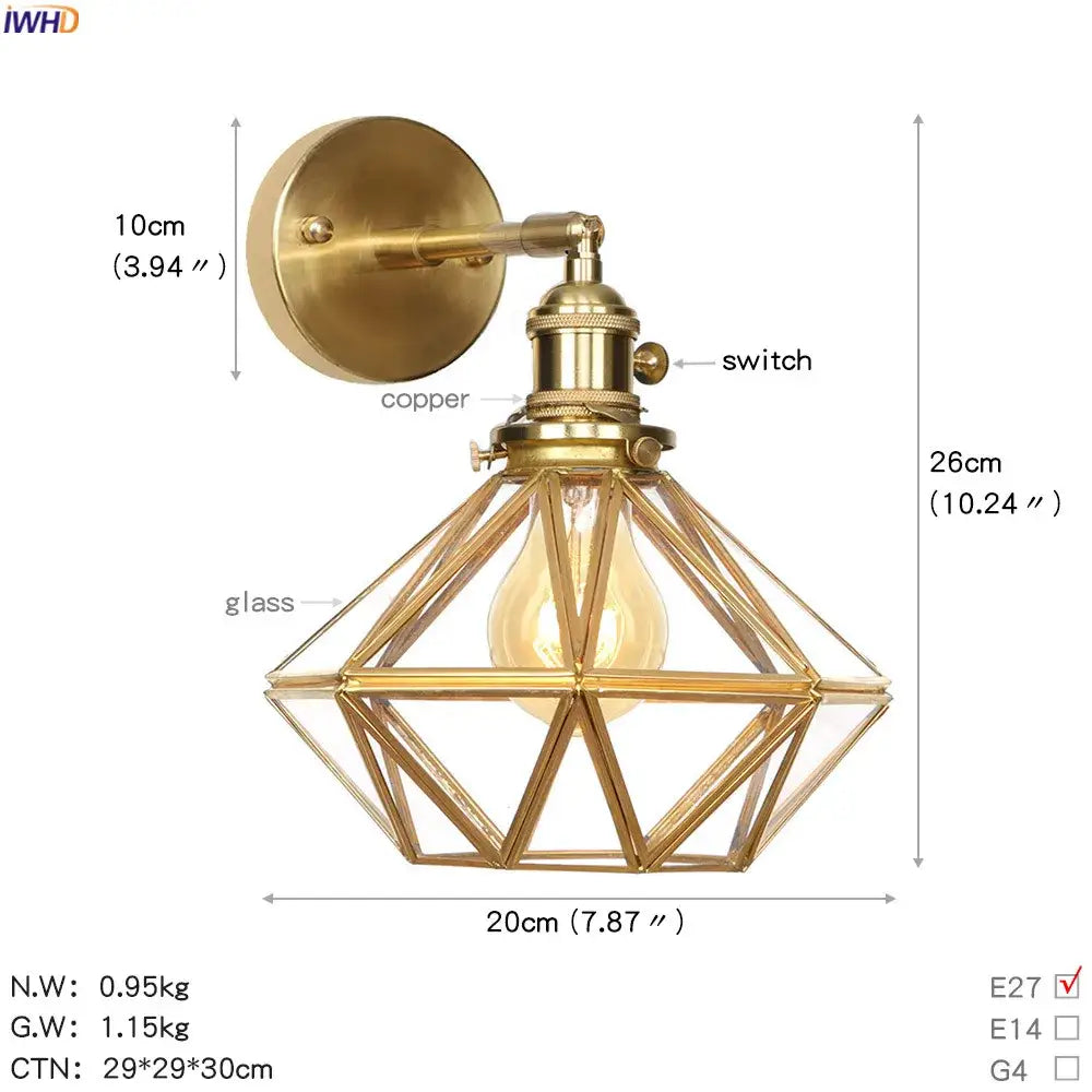 Vintage brass etched glass globe led wall light with a geometric brass-finished cage and exposed bulb for bedroom use