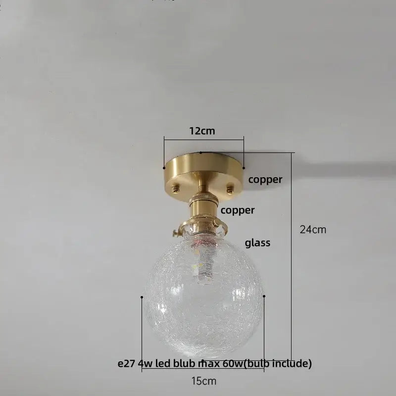 Vintage brass etched glass led ceiling light with clear textured glass globe and copper finish mounting base for living room