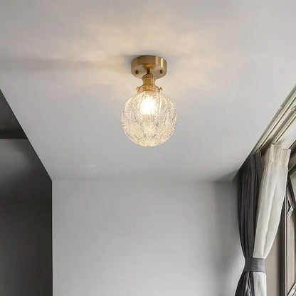 Vintage brass etched glass led ceiling light with a clear textured glass globe for living room ceiling light use
