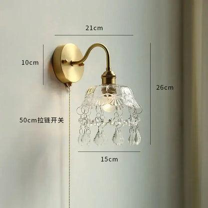 Vintage brass floral wall sconce with clear faceted glass led shade and crystal droplets for glass led bathroom decorbites
