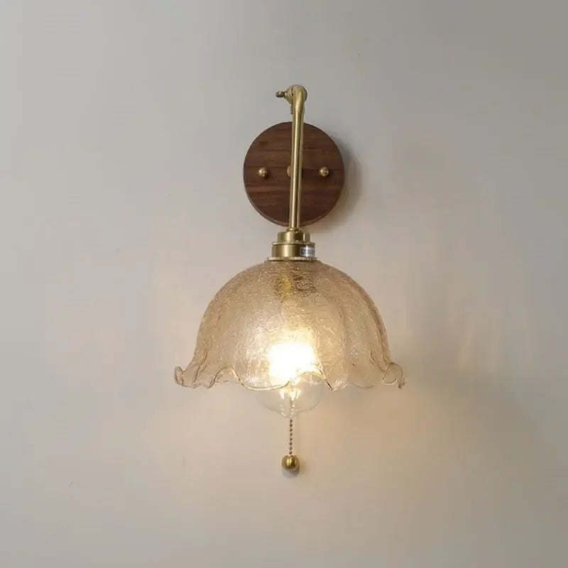 A warm-toned textured glass vintage brass led wall light with rotate pull chain for bedroom decorbites led wall