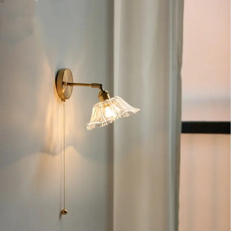 Vintage brass fluted glass bedside sconce wall light with gold-toned finish and elegant pull-chain switch decorbites glass bedside