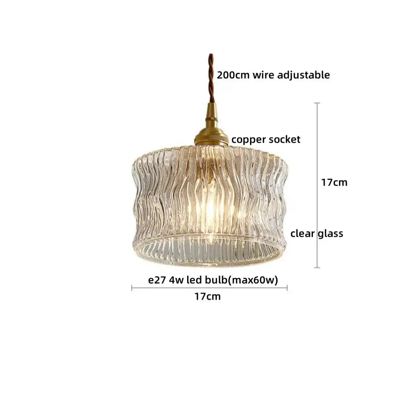 A vintage brass fluted glass led pendant with textured ribbed design and copper socket for dining room lighting