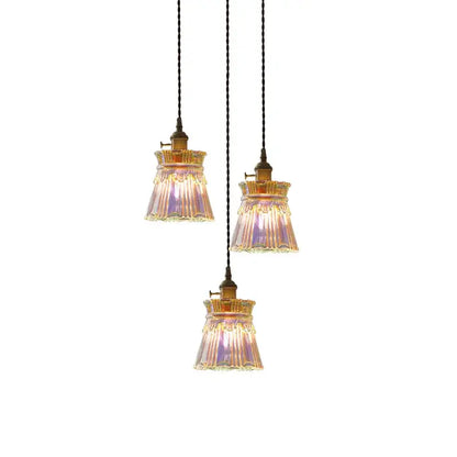 Three vintage-style brass fluted glass led pendant lamps with iridescent shades for dining room lighting