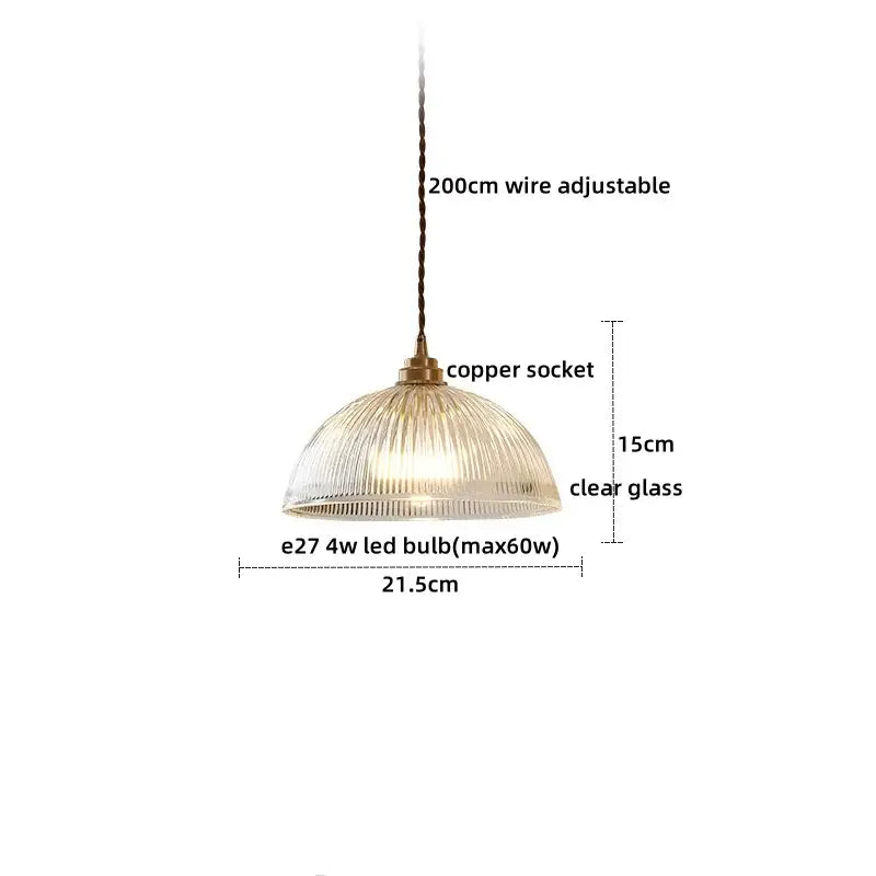 A clear glass led pendant with a ribbed dome shade and copper socket ideal for dining room lighting
