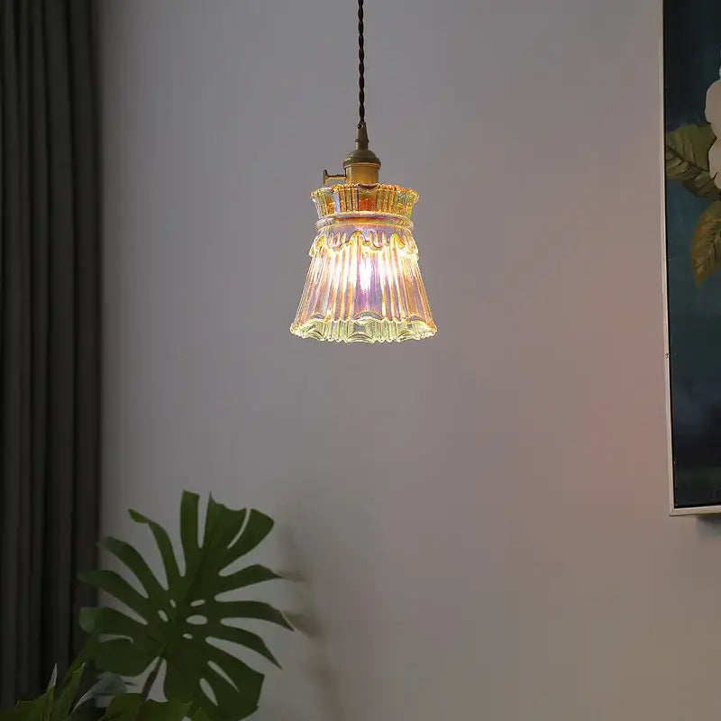A warm amber-tinted vintage brass fluted glass led pendant lamp ideal for dining room lighting
