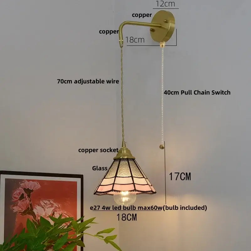 Vintage brass glass brass led wall sconce with stained glass shade in pink and amber hues, adjustable wire and pull chain
