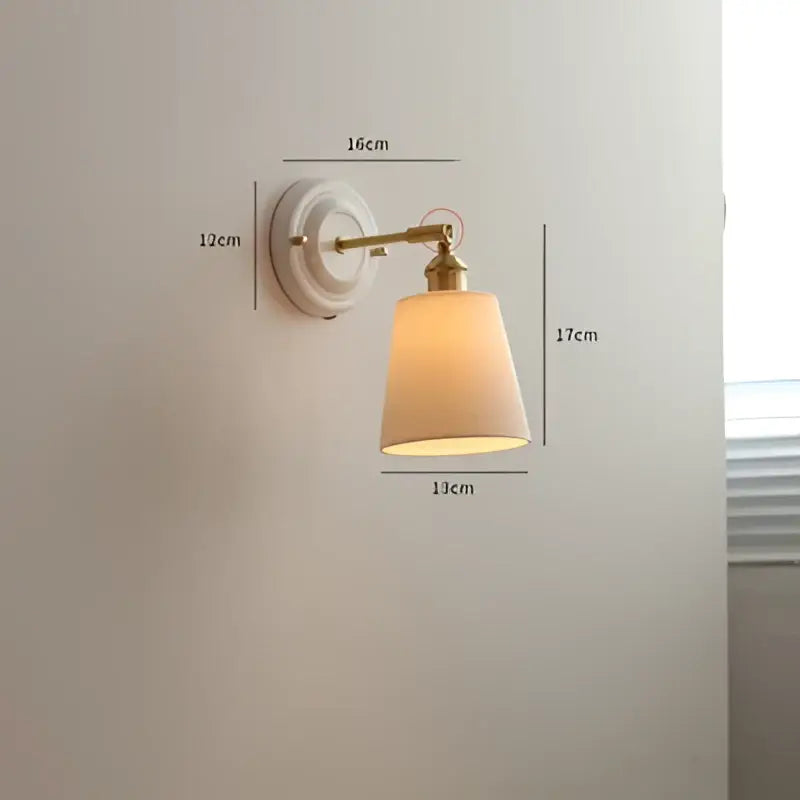 Vintage brass globe wall sconce with decorbites copper arm led and beige fabric shade diffusing warm light