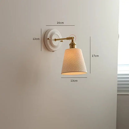 White textured ceramic wall sconce with brass-finished copper arm and ribbed glass shade for vintage bedroom decorbites copper arm led lighting
