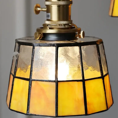 Vintage brass led pendant light featuring an amber glass stained lampshade with brass led pendant fixture decorbites